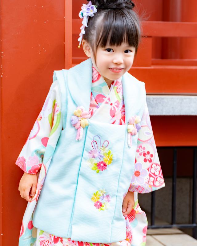 A three-year-old child wearing a traditional Japanese vest (hifu).