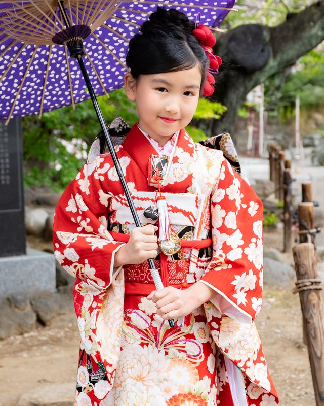 A seven-year-old child in a formal furisode kimono.